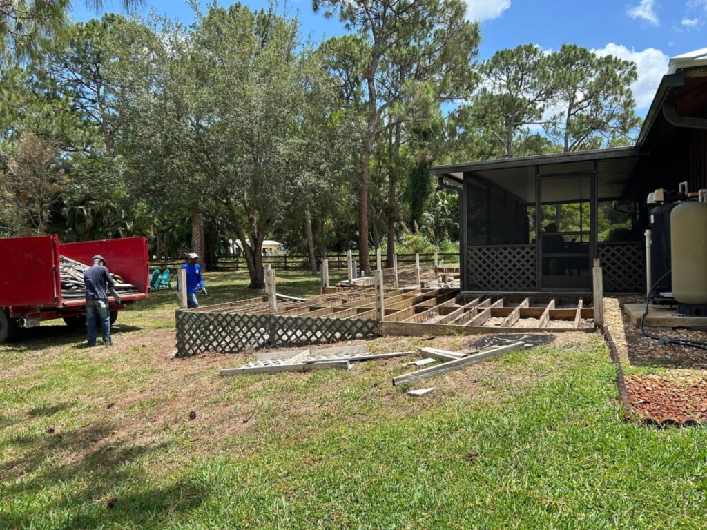 Wood deck removal debris loaded into a dump trailer in Palm Beach County, FL.