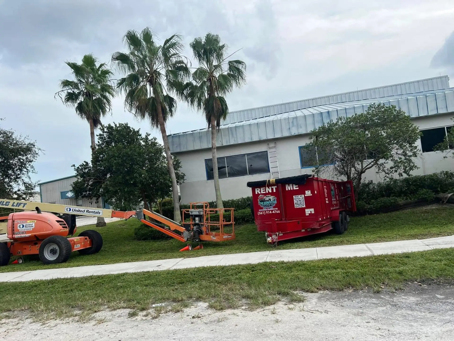 Tree-trimming debris being loaded into a dump trailer in Loxahatchee, FL.